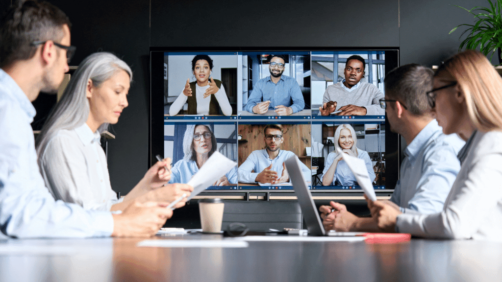 A team meets with their European domiciled legal representation via video chat.
