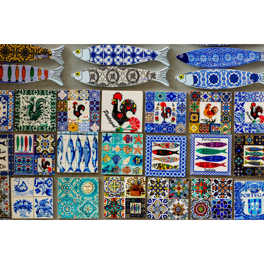 Sardines, gorgeous tiles, roosters, and other symbols of Portugal on an array of pretty tourist magnets.
