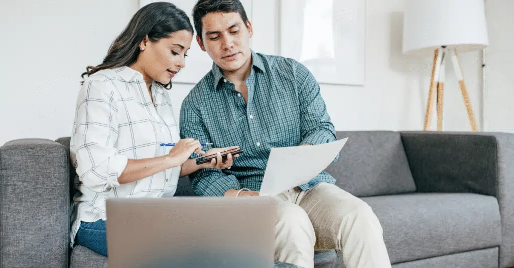 couple doing taxes as remote workers